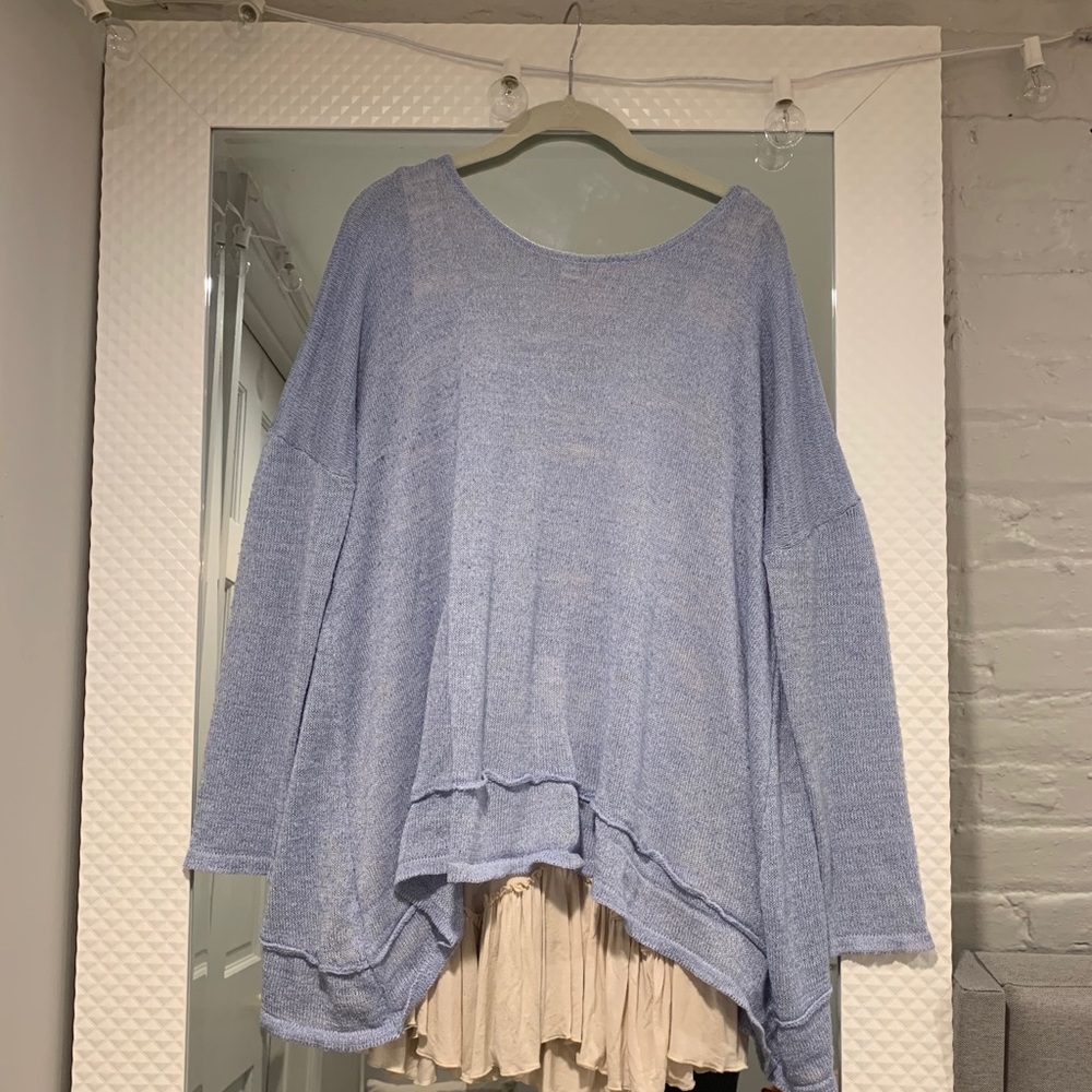 Hope’s blue sweater with ruffle layering tank